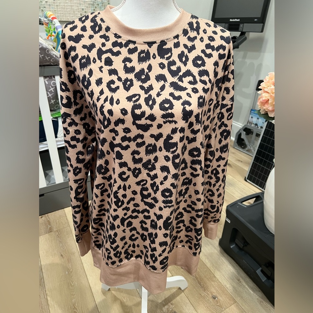 Leopard print top with slits on each side. Size L